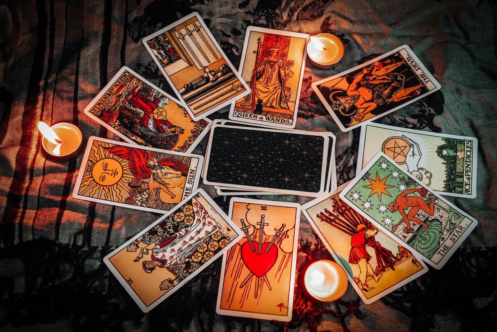 tarot-reading-with-tarot-card-background-and-candlelight-on-the-table-for-astrology-occult-magic-spi-ing-fortune-teller-tarot-reader-free-photo-1452035794.thumb.JPG.e699fb98523ea32fe543a0c6175a750d.JPG